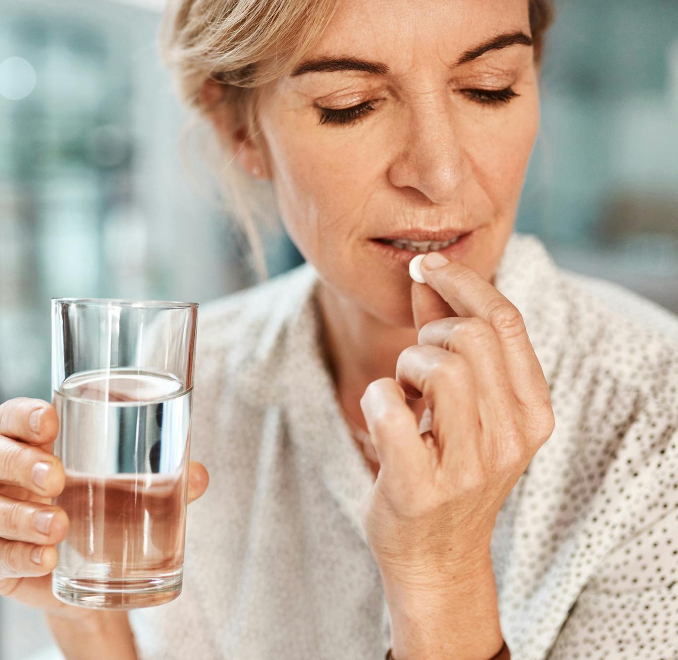 woman taking medicine