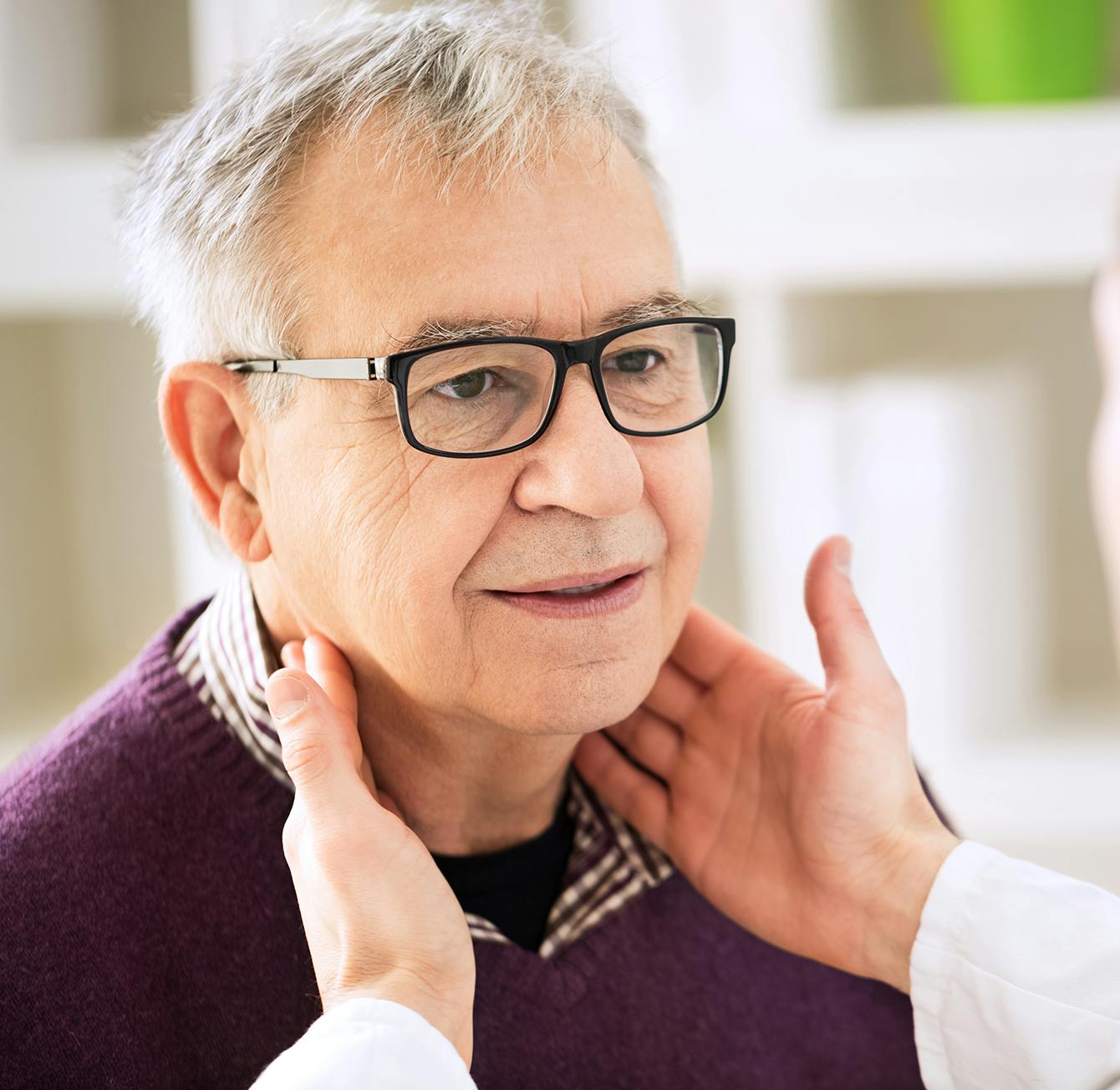 doctor checking patients lymph nodes