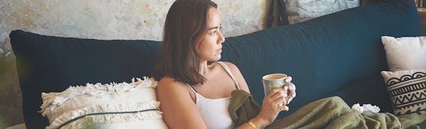 woman sitting with a coffee mug