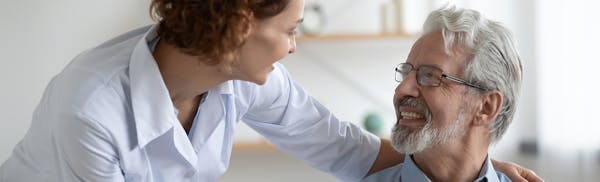 doctor speaking with older male patient