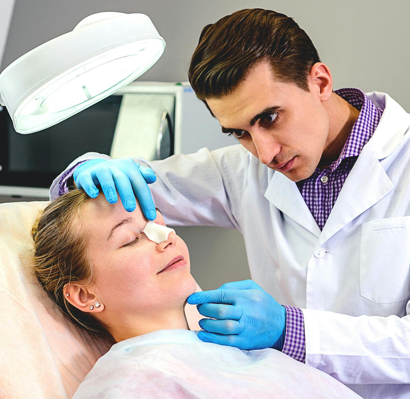 doctor working on a patients nose