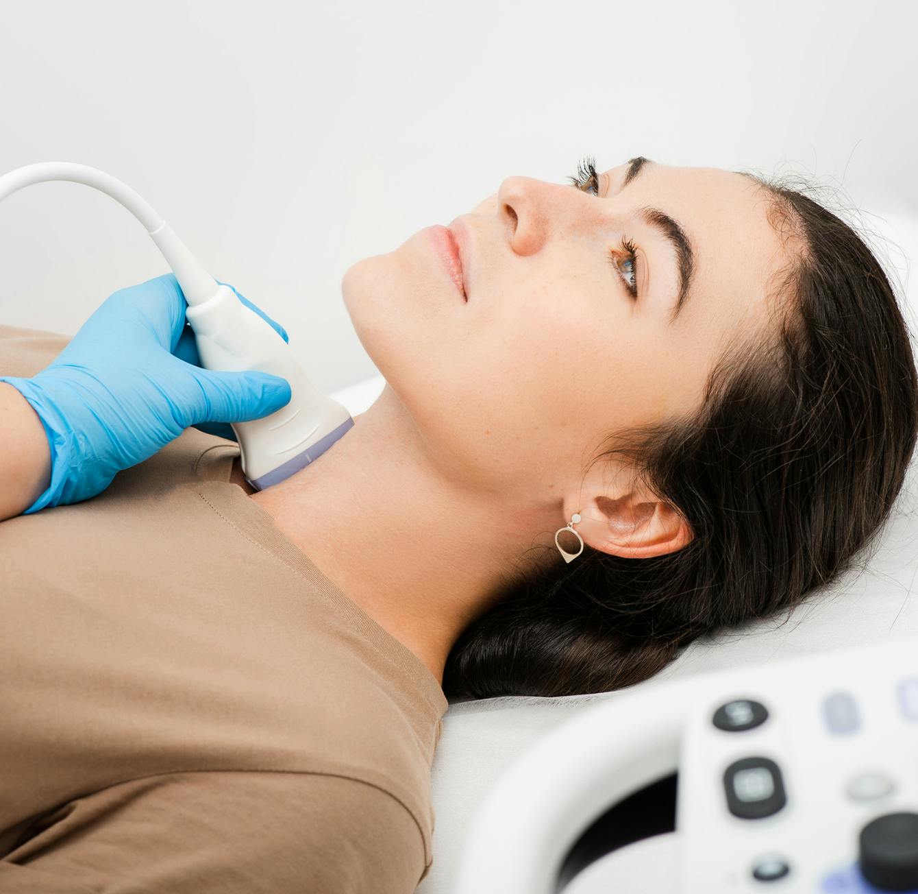 woman getting her thyroid checked