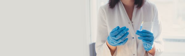 doctor holding a syringe