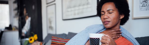 woman having difficulty swallowing