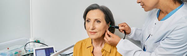 doctor lookingo at patients ear