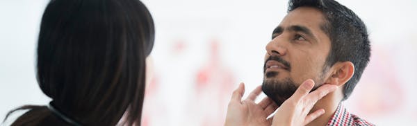 doctor checking for enlarged lymph nodes