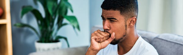 man coughing