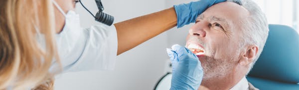 doctor checking patients salivary glands