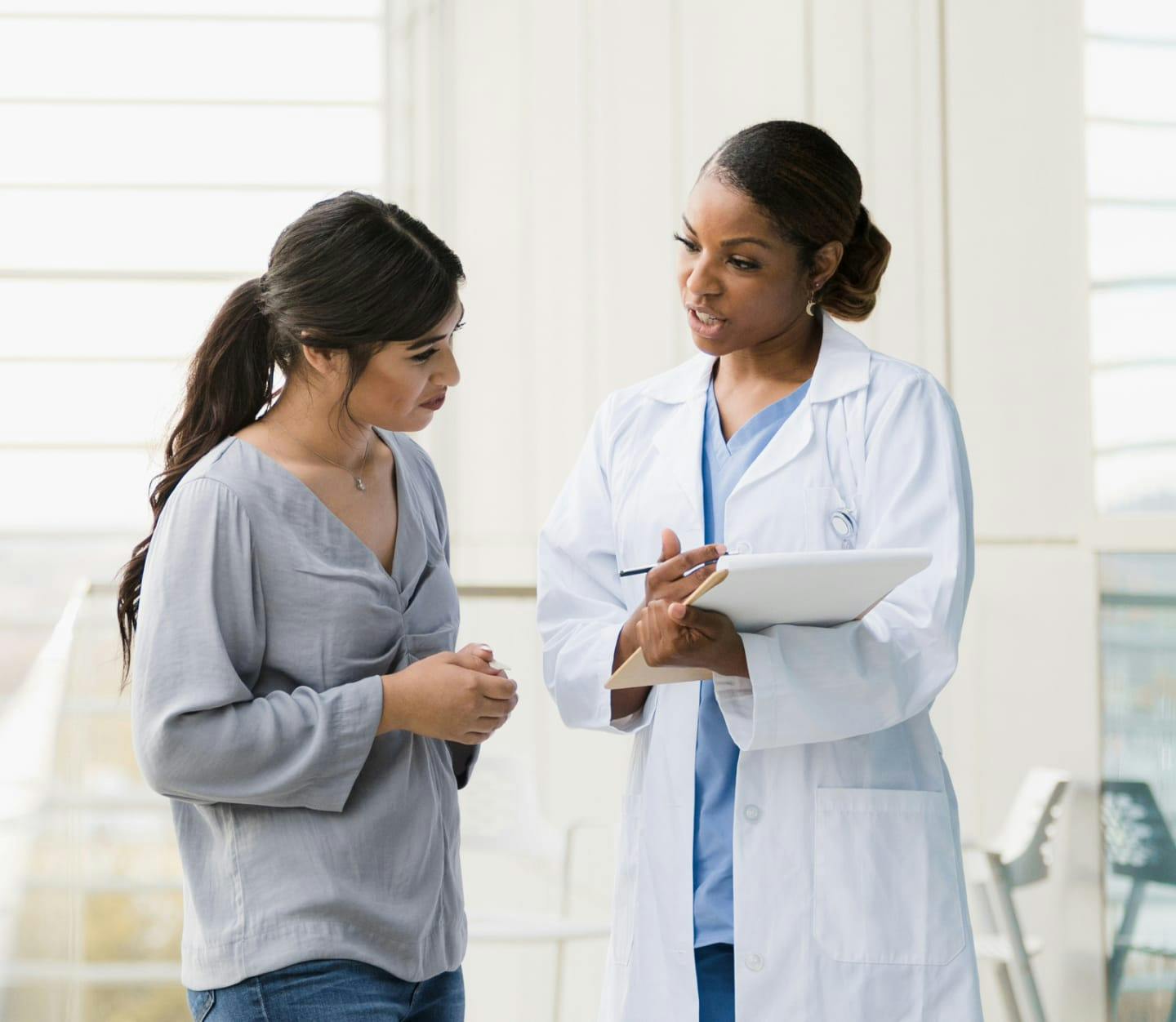 Physician examining a patient's ear