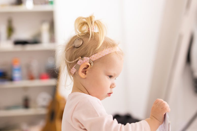 toddler with cochlear implant