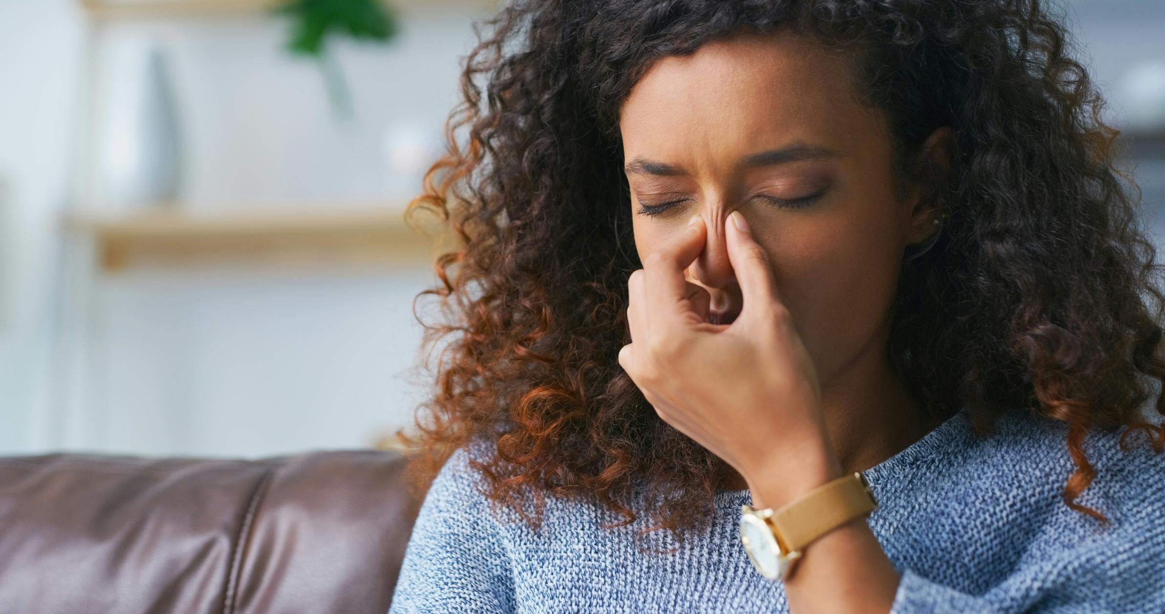 woman holding sinus