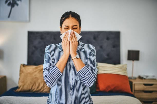Woman Blowing Her Nose