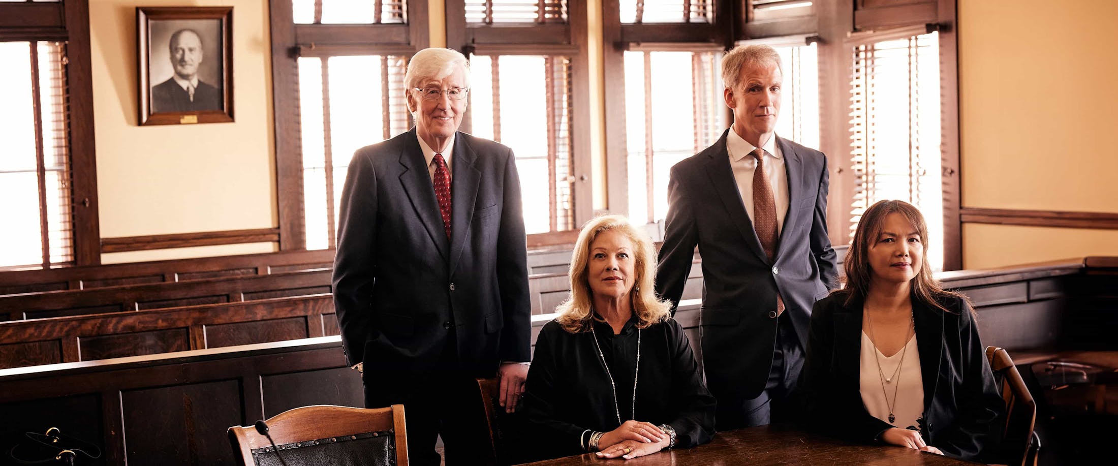 four attorneys in courtroom