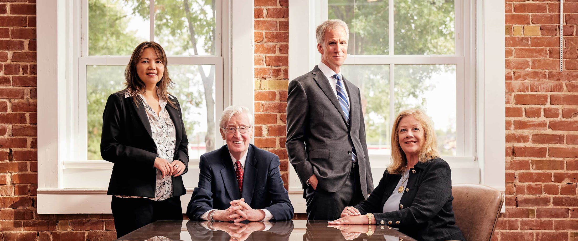 Four attorneys smiling