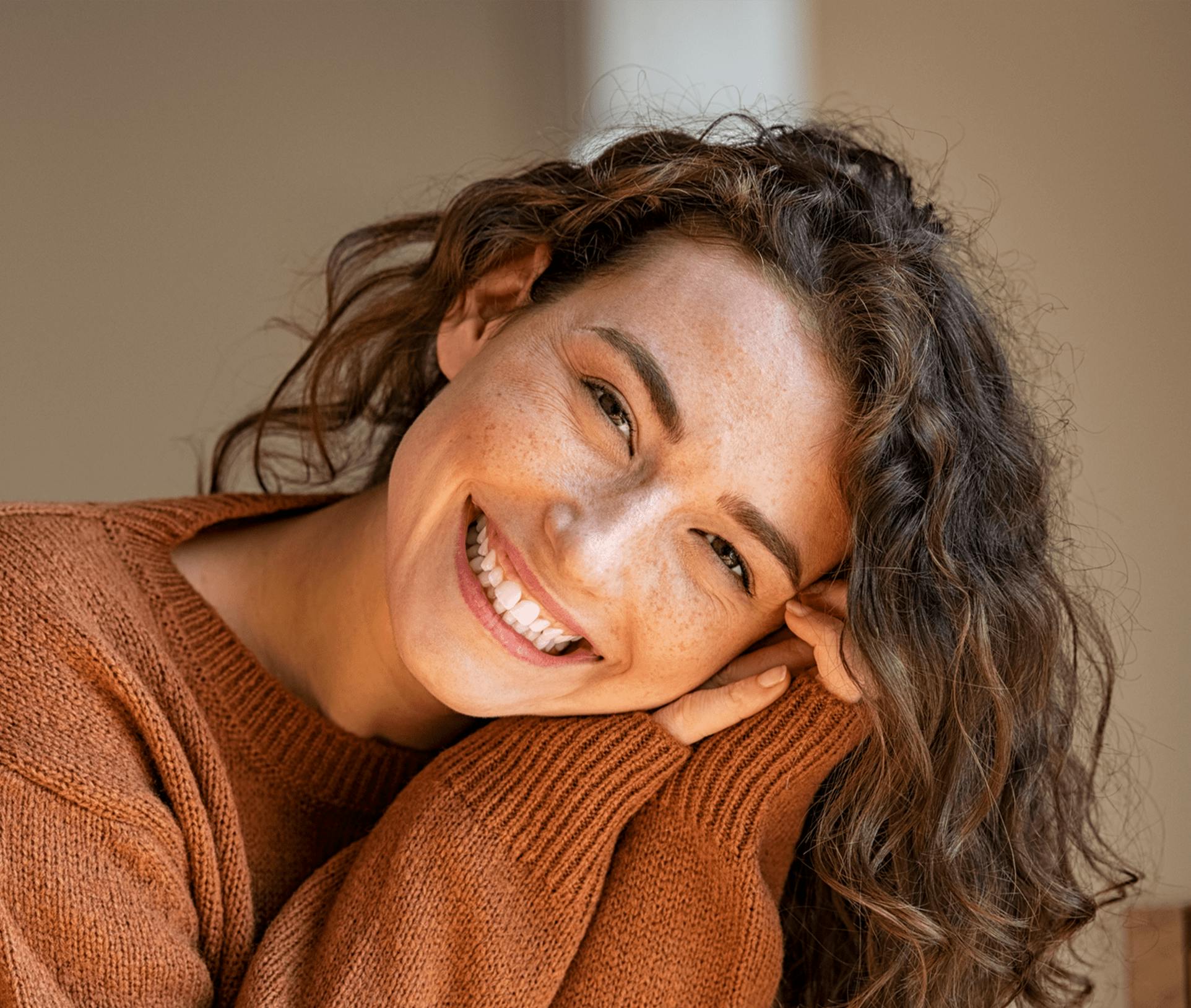 smiling woman leaning on her hands