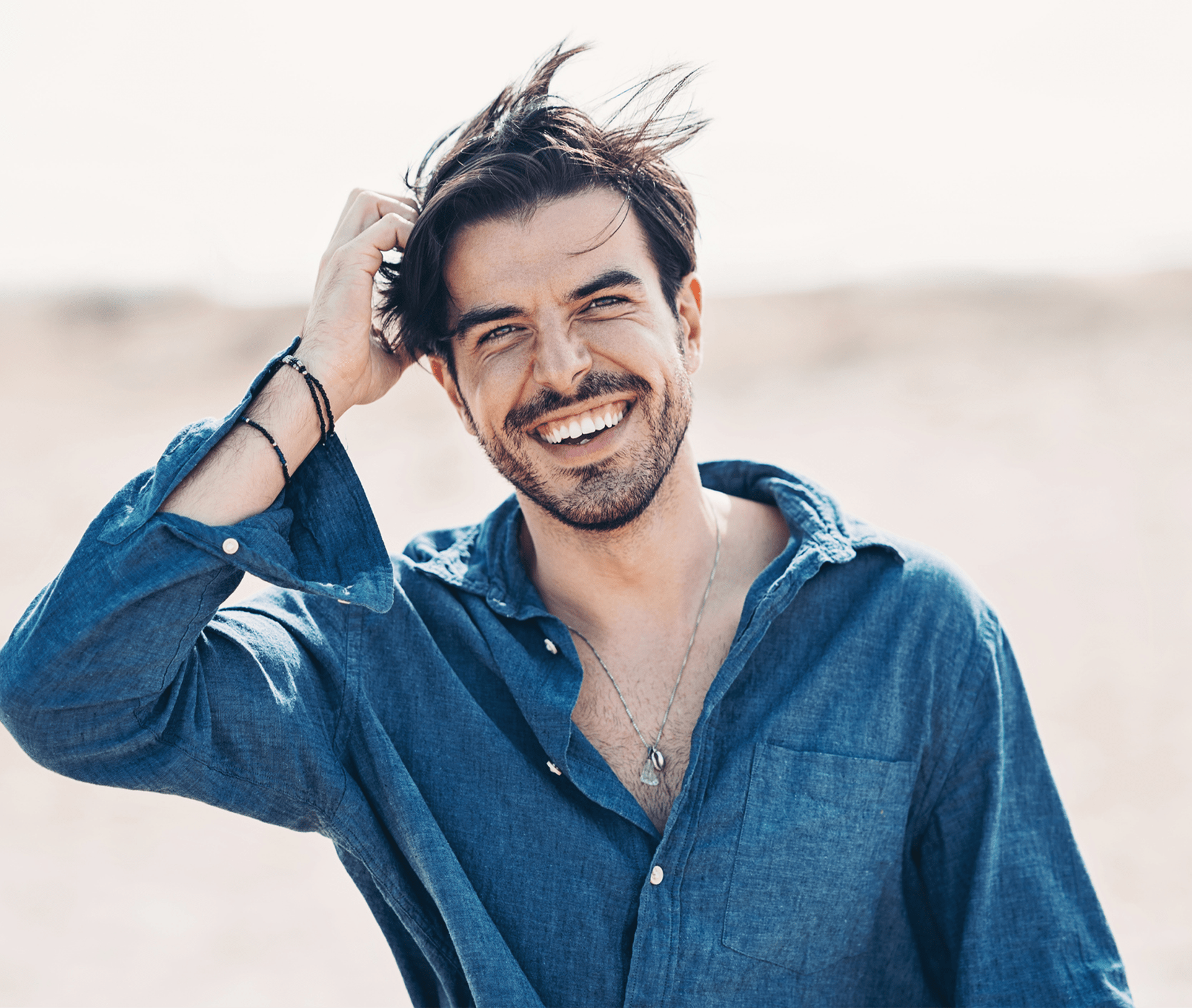 man touching his hair