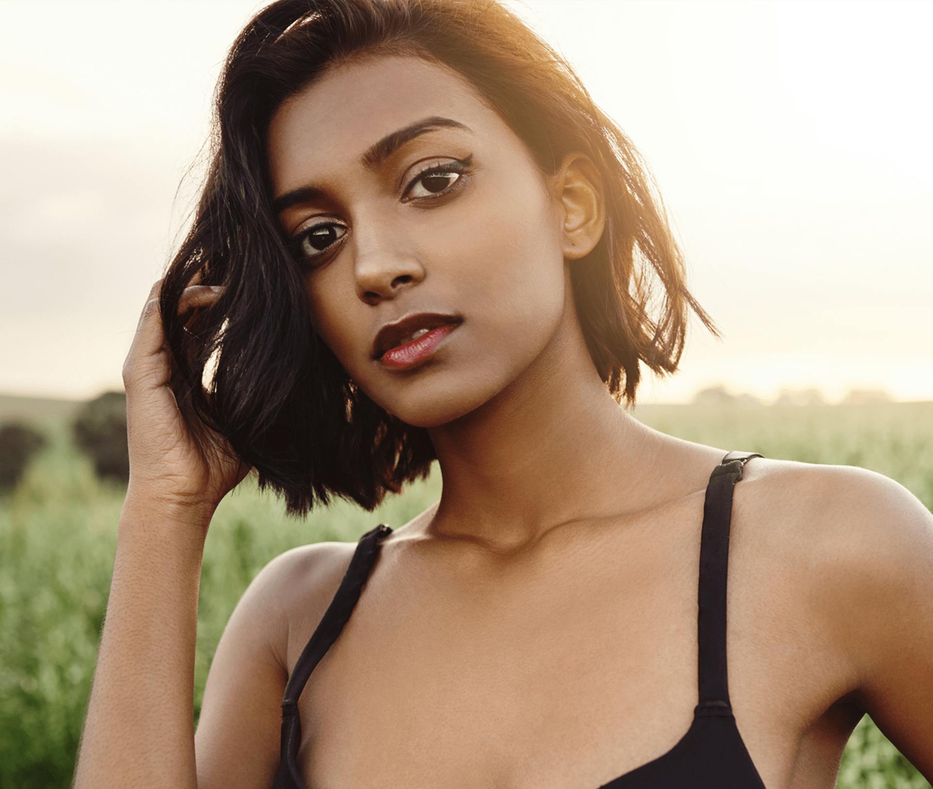 woman touching her hair