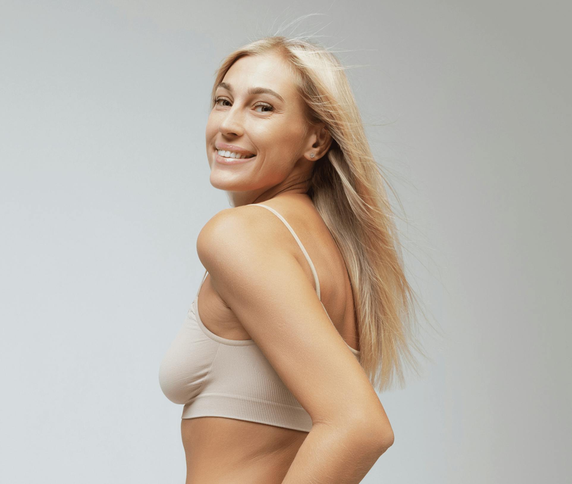 woman looking over her shoulder smiling