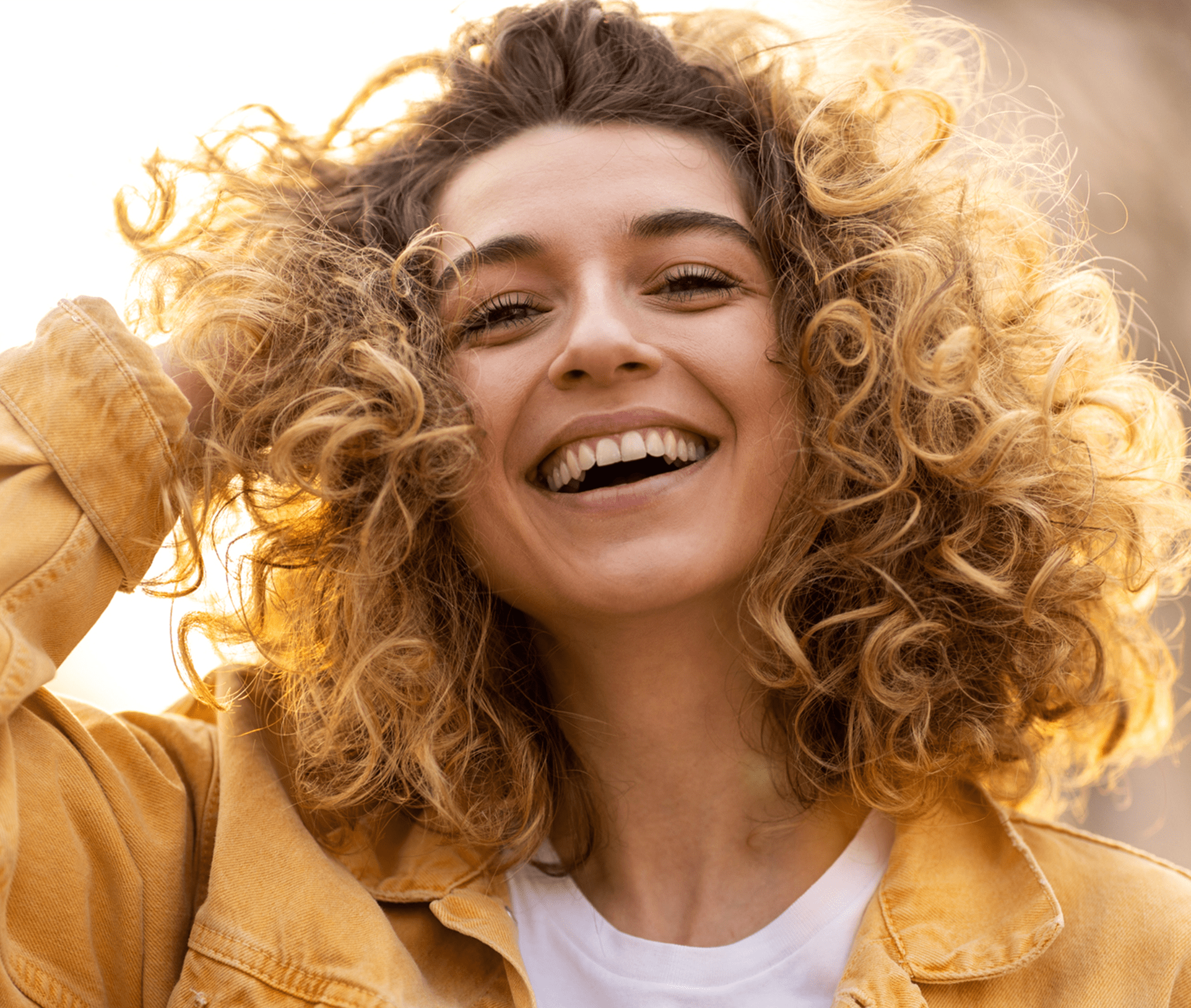 smiling woman with curly hair