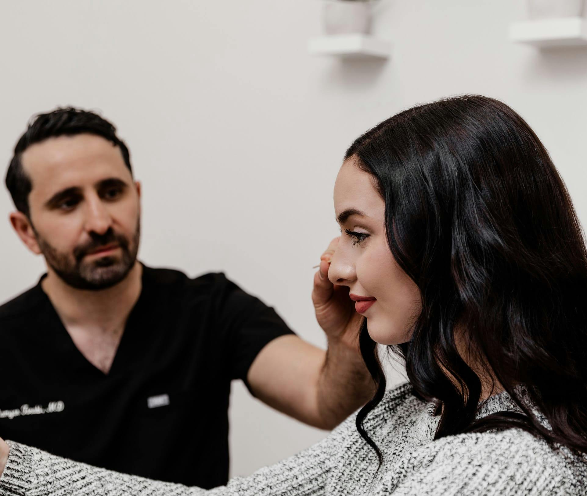 doctor pointing to patient's face