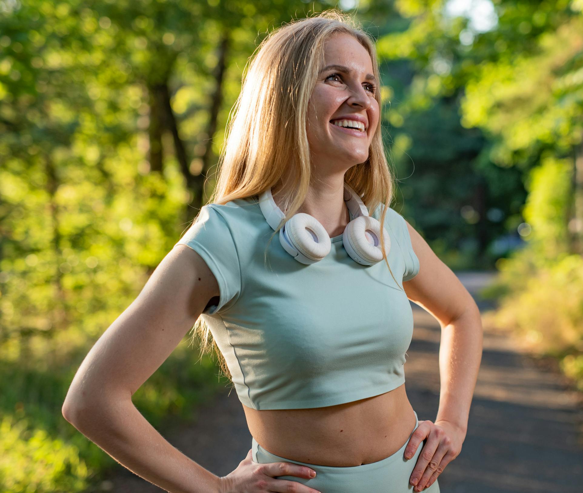 smiling woman with her hands on her hips