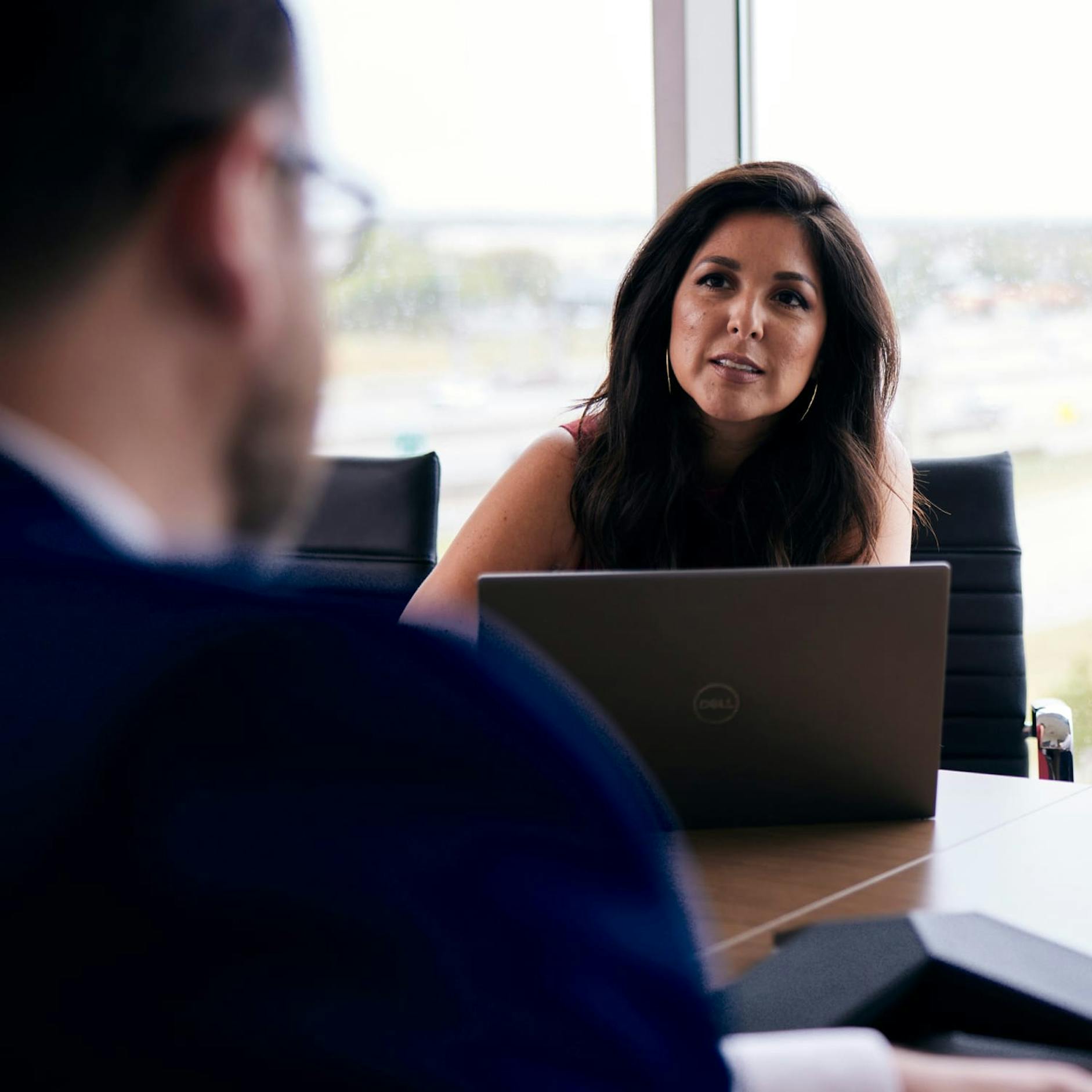 Bryce Hopson and Gloria Campos in a meeting