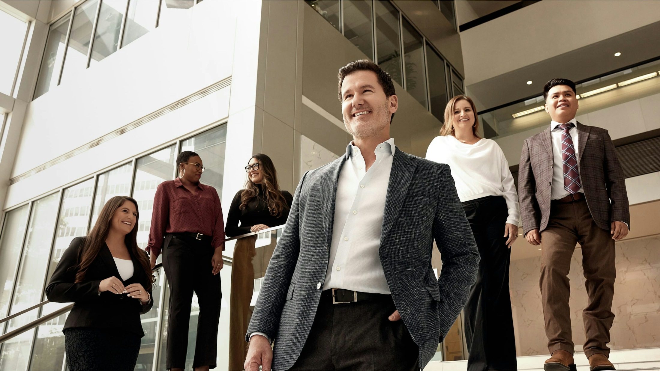 Davis Law Group staff standing on office stairs