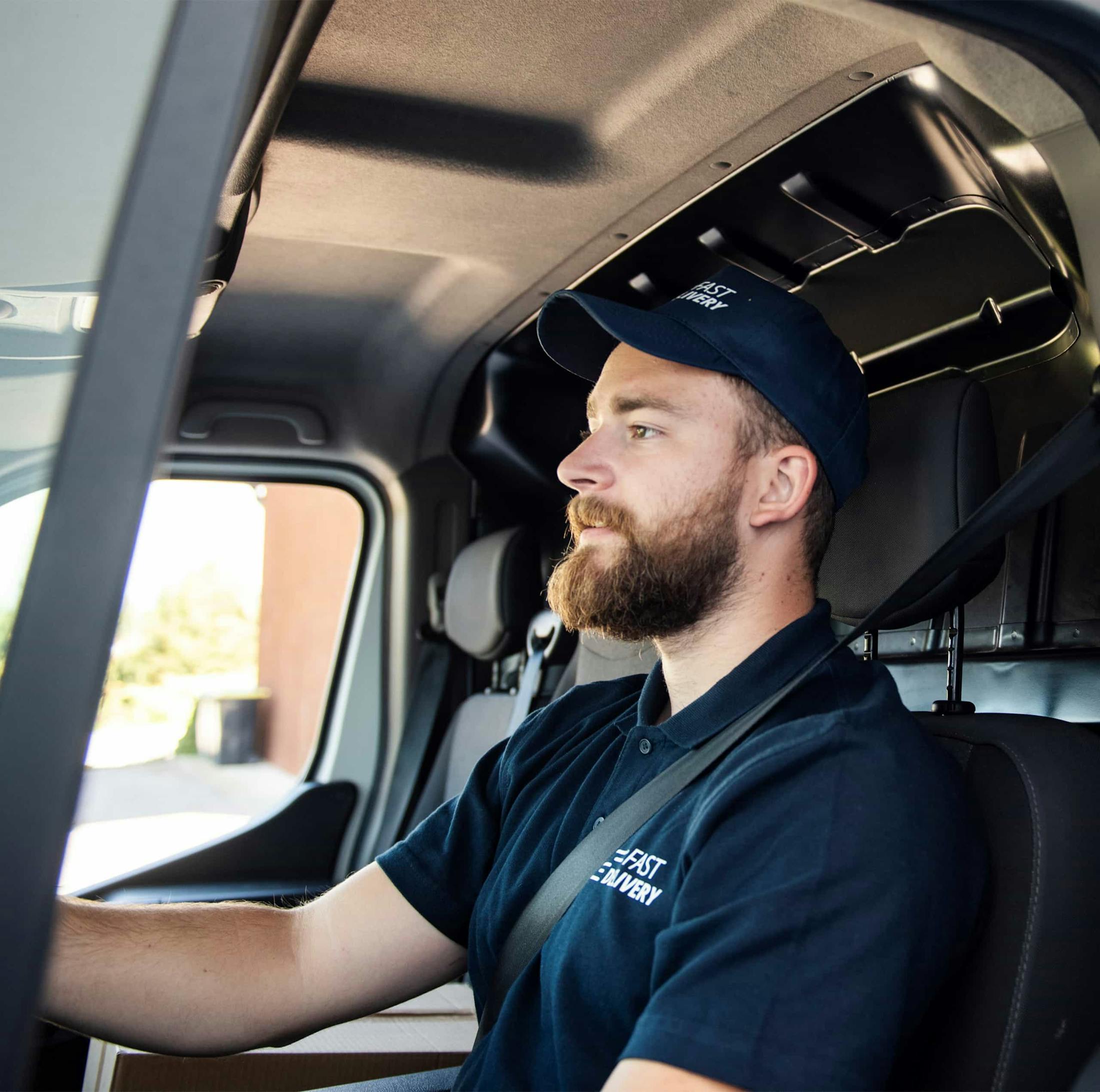 A man driving a commercial truck