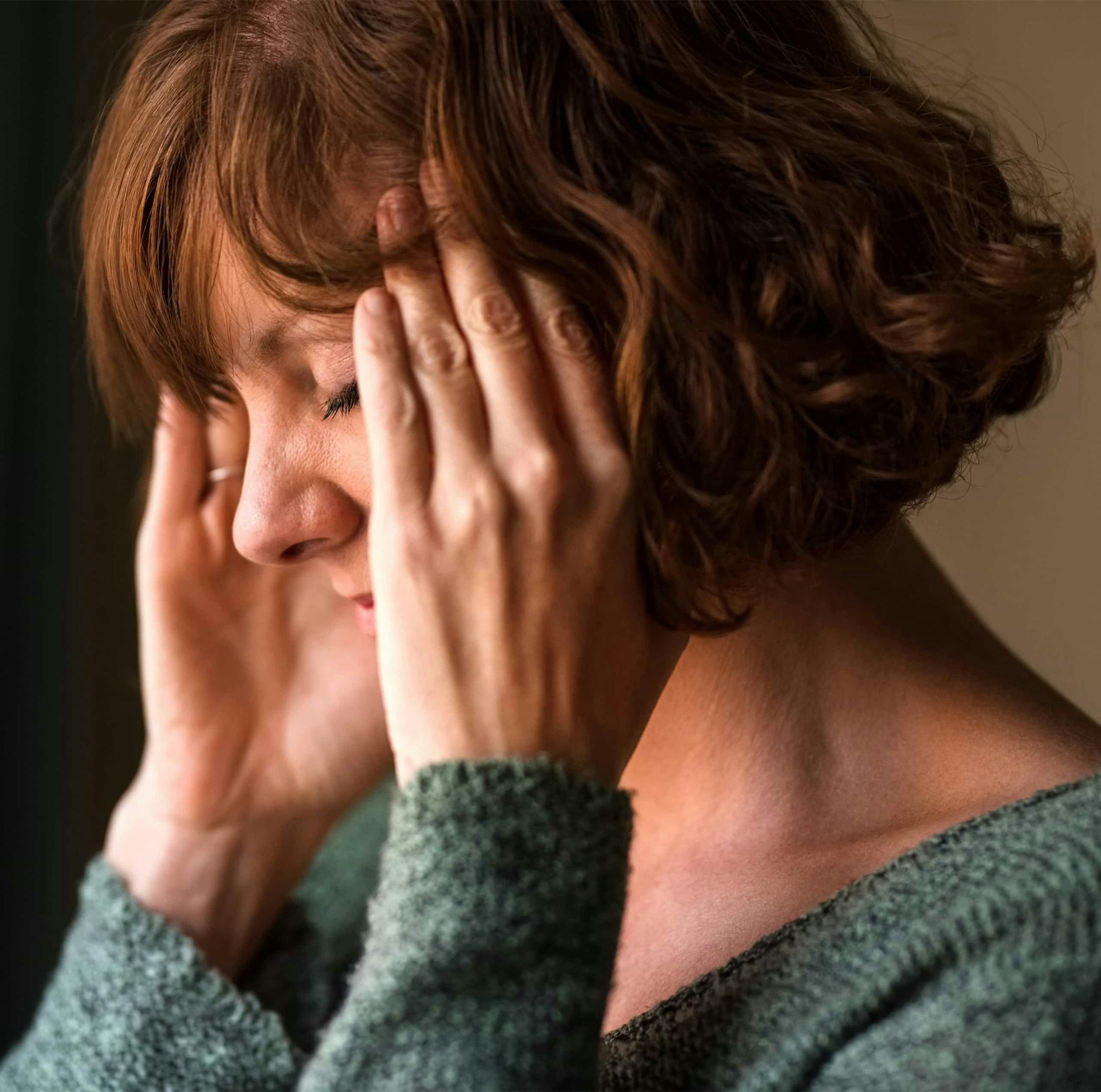 Woman holding her head