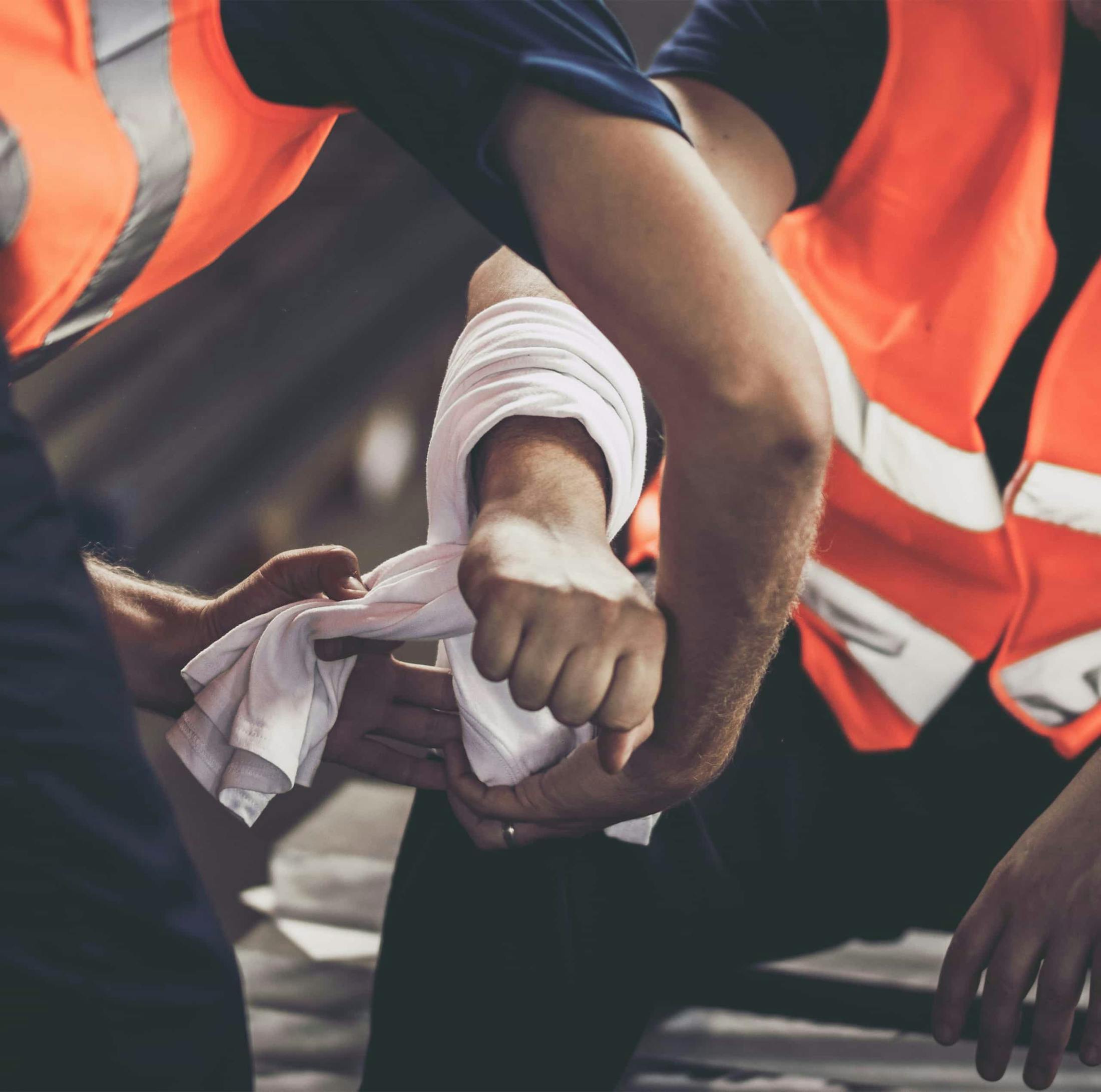 Workers tending to an injury