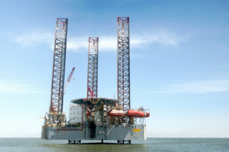 An oil rig out in the water