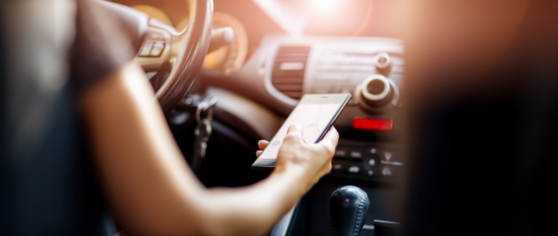 person texting and driving