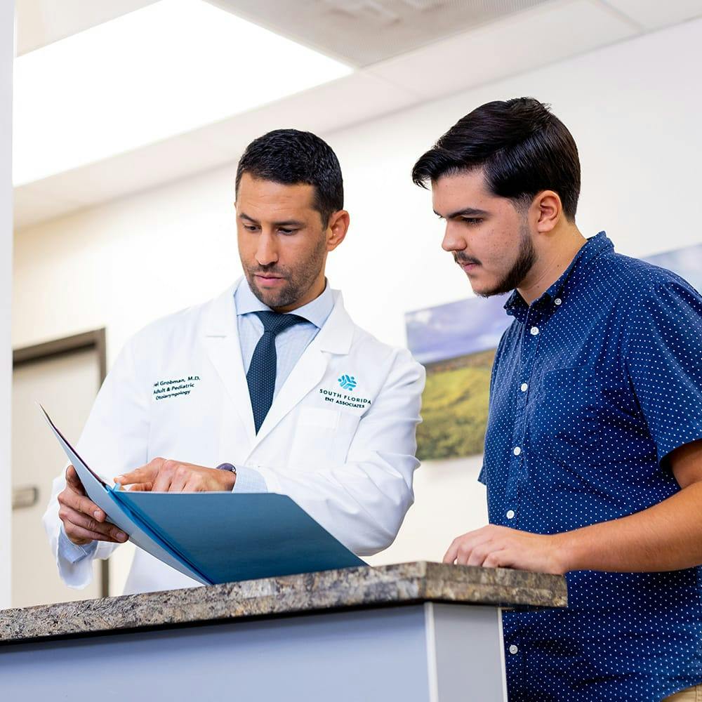 doctor and patient looking at documents