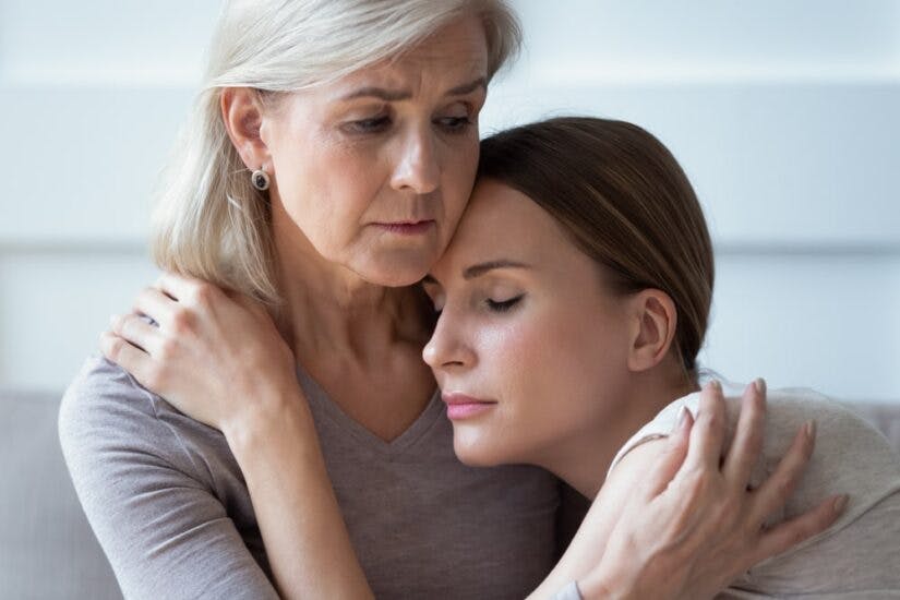 Two Sad Women Holding And Comforting Each Other