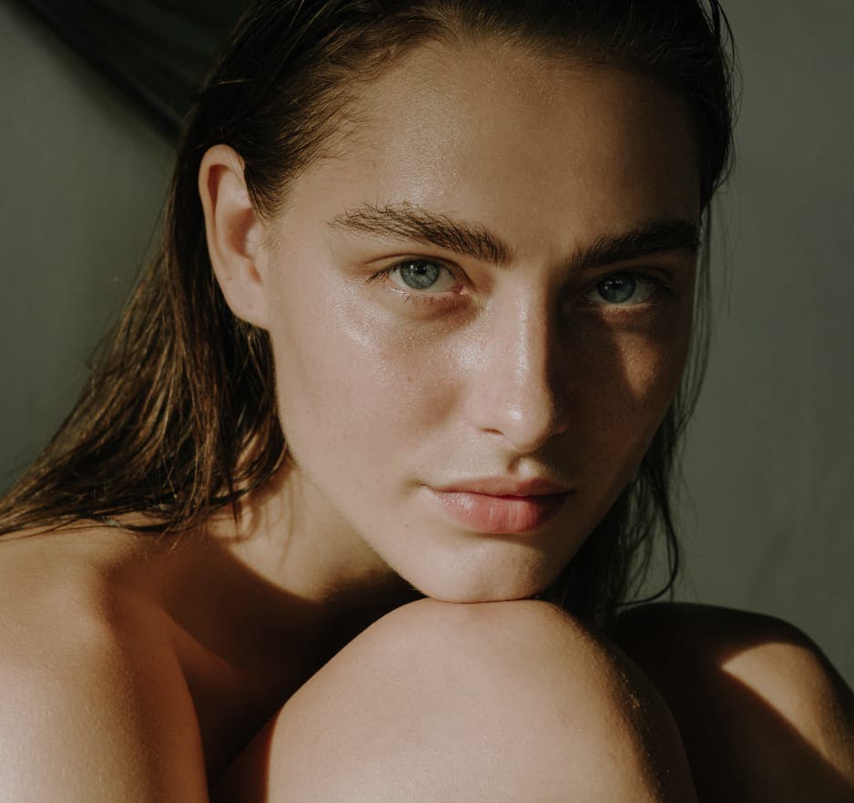 Woman with her chin on her knee
