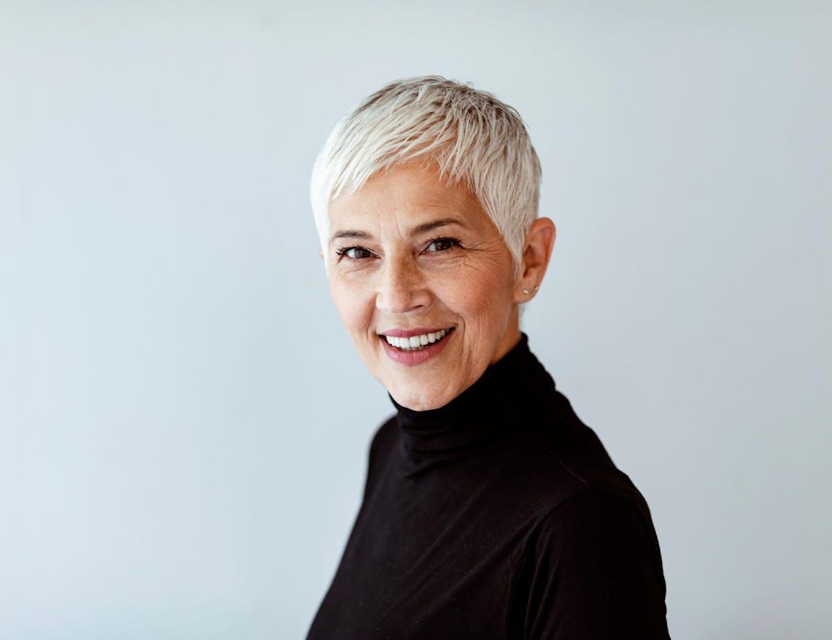 older woman in black turtleneck