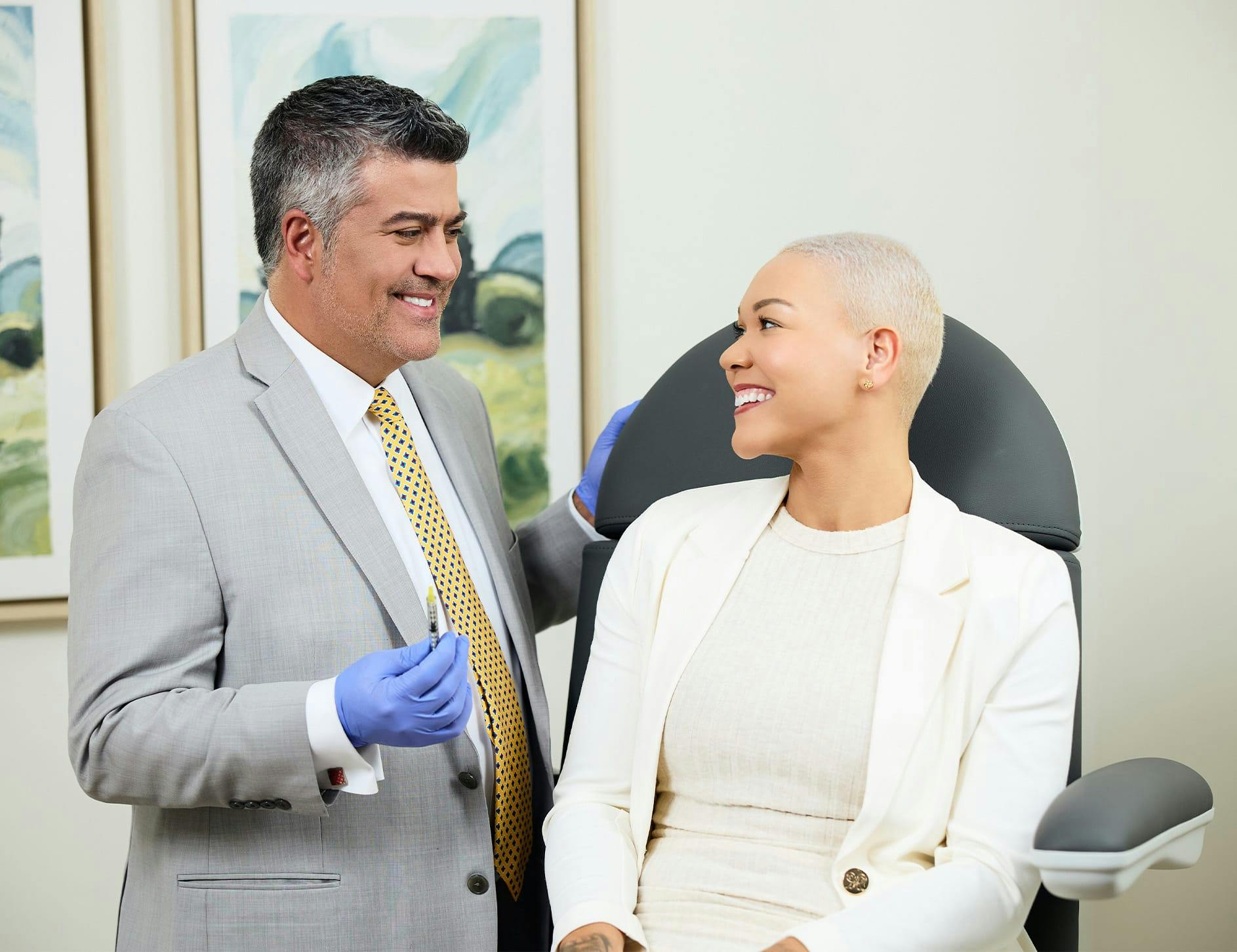 Dr. Higdon and patient smiling at eachother