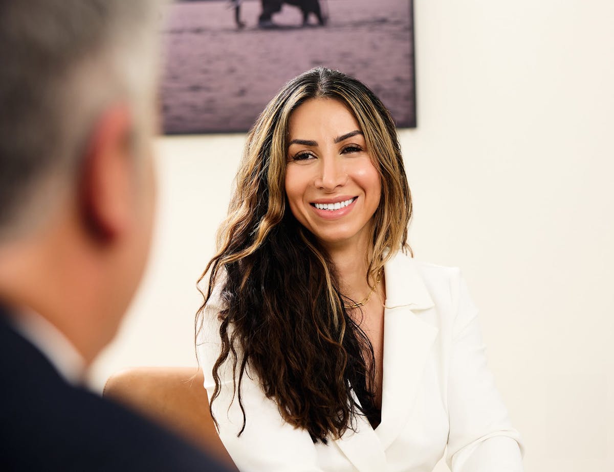 patient smiling at Dr. Higdon