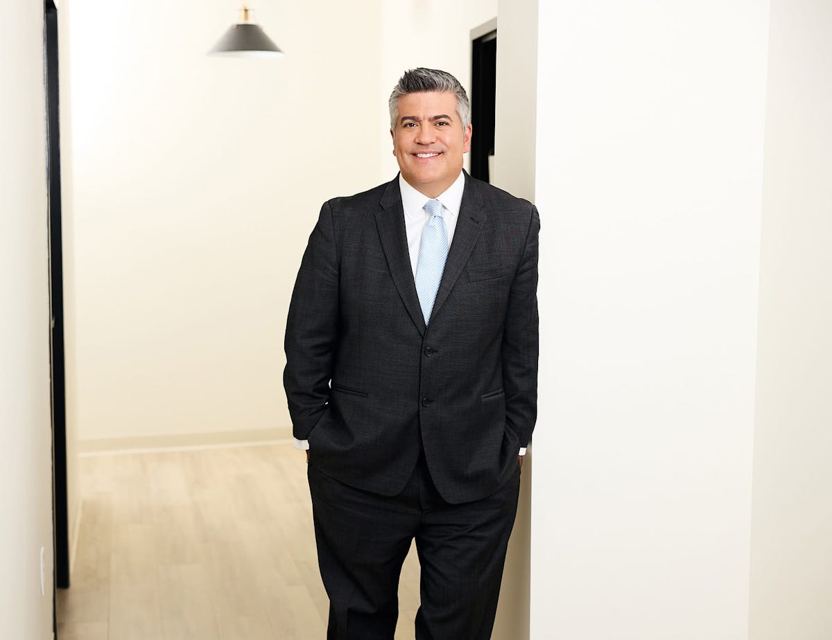 Dr. Higdon standing at an archway