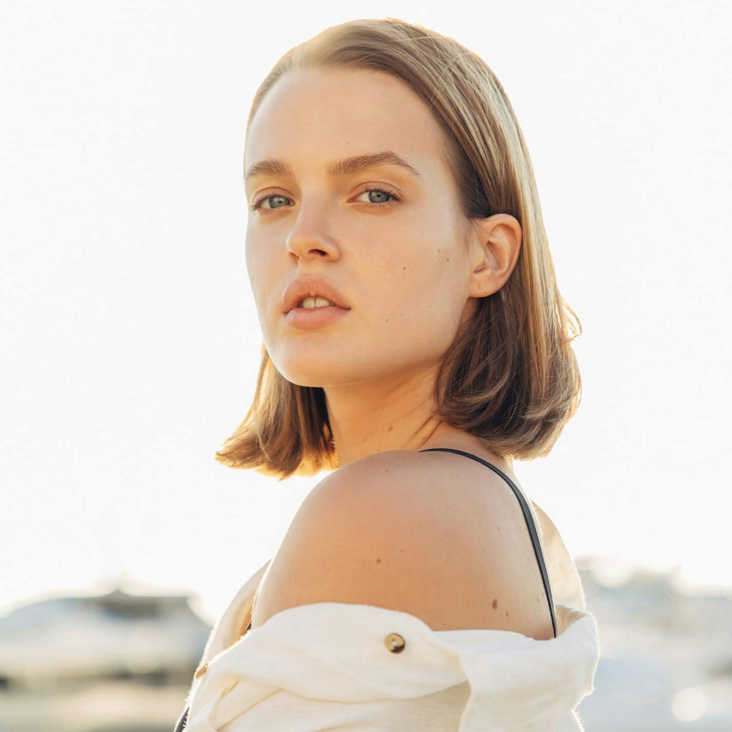 woman with short hair looking forward
