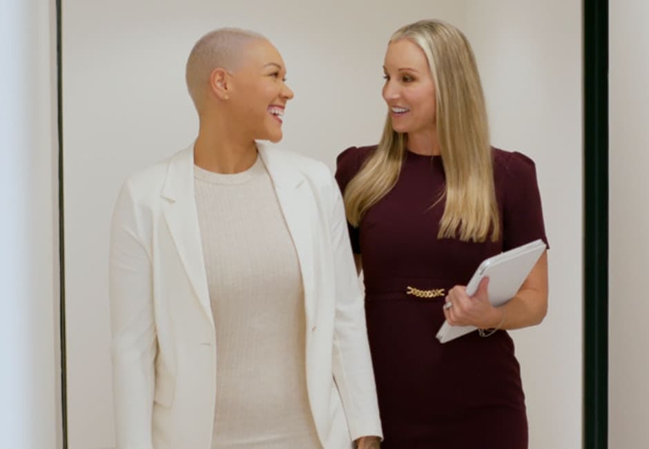 doctor and patient smiling while talking to eachother