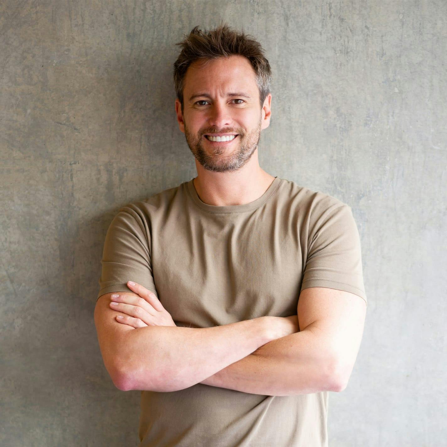 Dr. Higdon with patient pointing at the top of her head while she looks in mirror