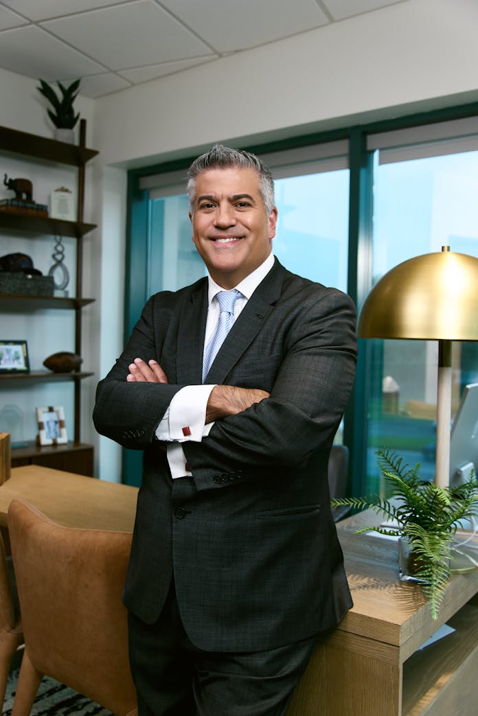Dr. Higdon standing at a desk