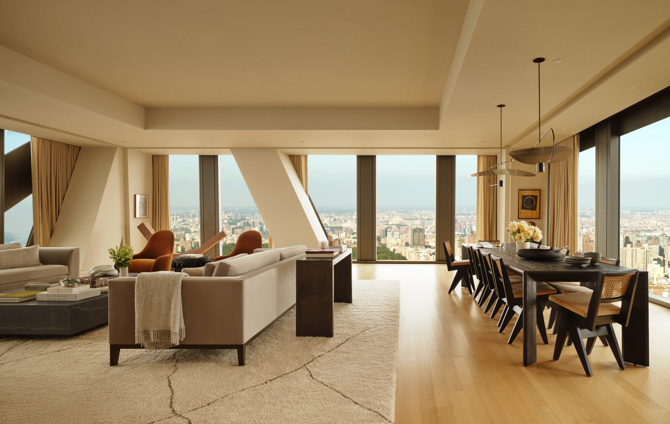 Living area and dining table in a midtown condominium with a view of NYC