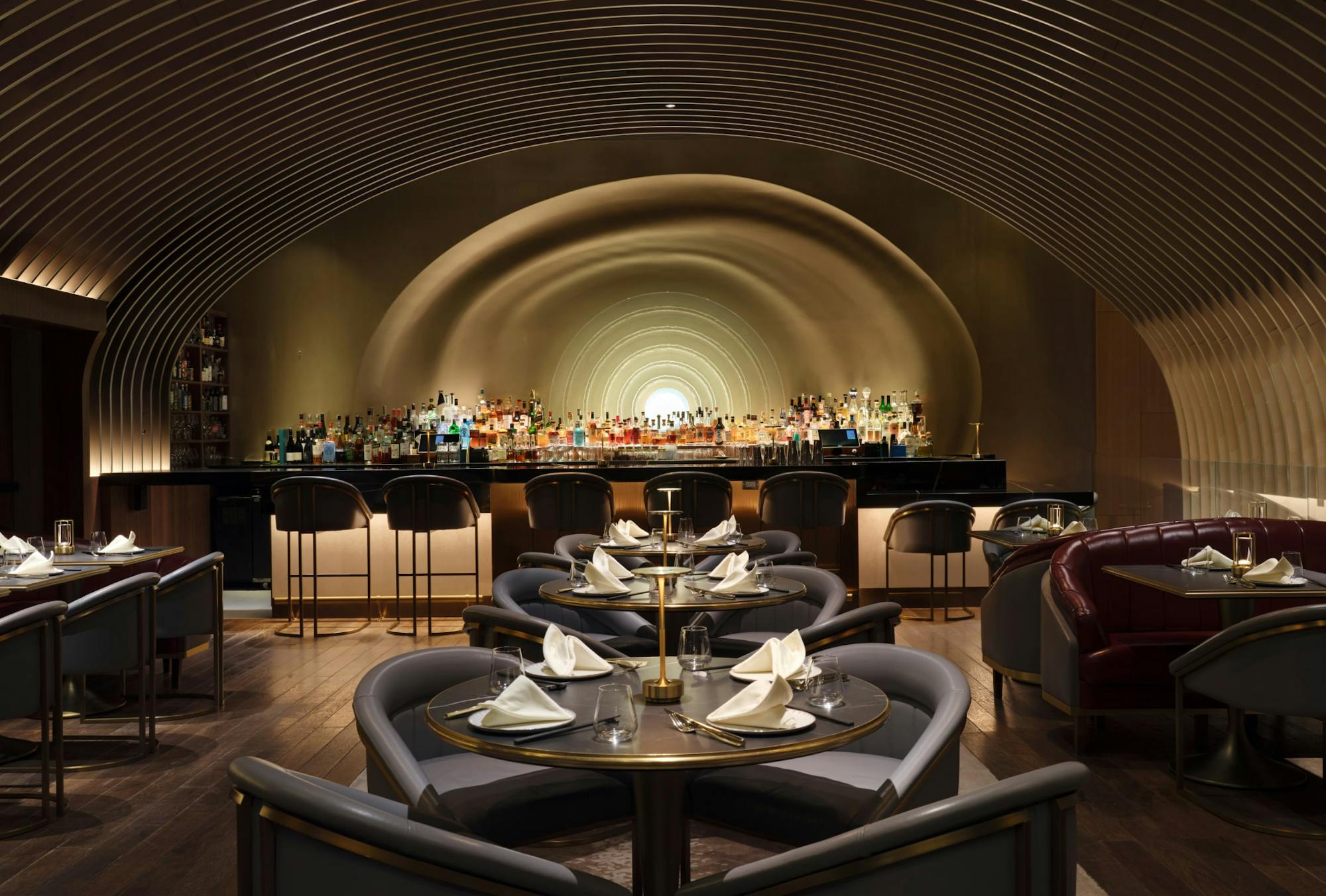 1710754195-53west53_amenities_04.jpg Dining tables and bar at 53 Restaurant NYC