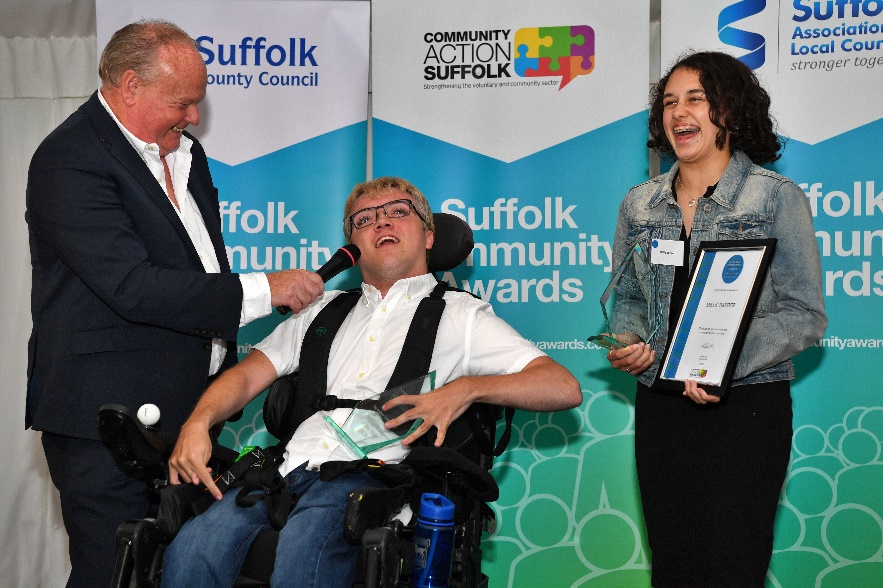 Compere Mark Murphy MBE with joint winners of the Andrew Tower Award, Harrison Mayhew Kemp and Millie Barber