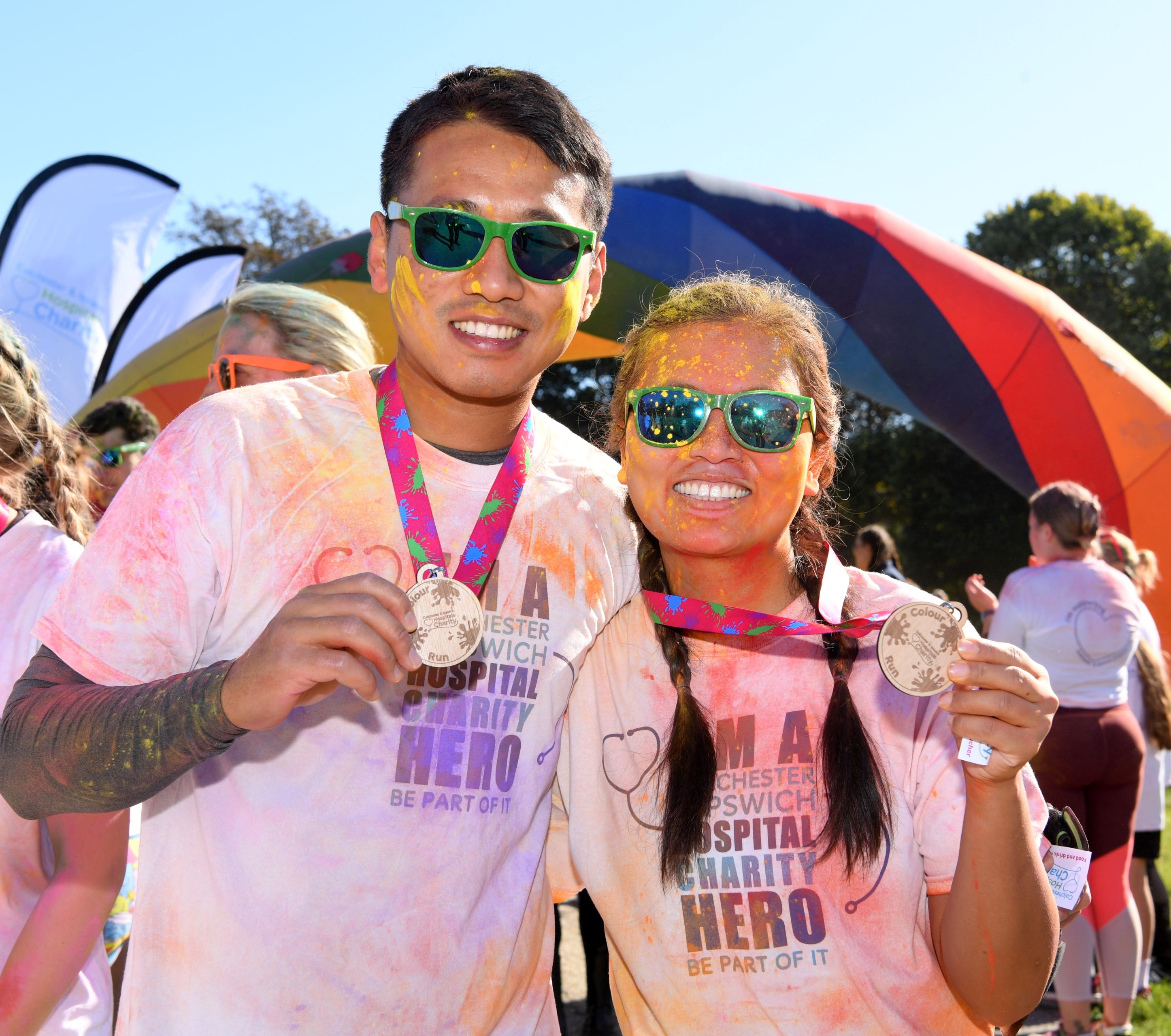 A couple of runners with their medals