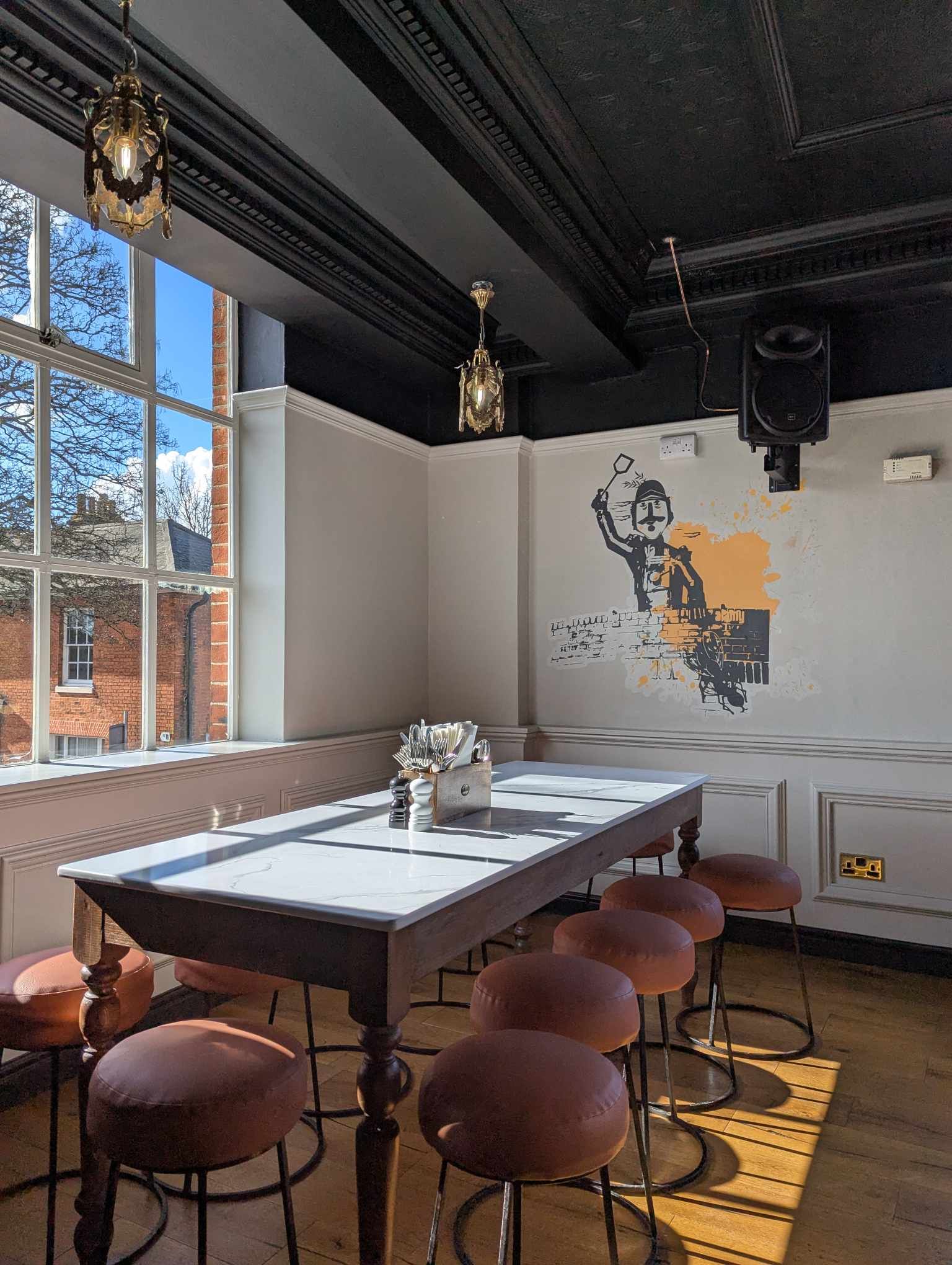 Major's Corner artwork on the wall of Tower Street Food Hall