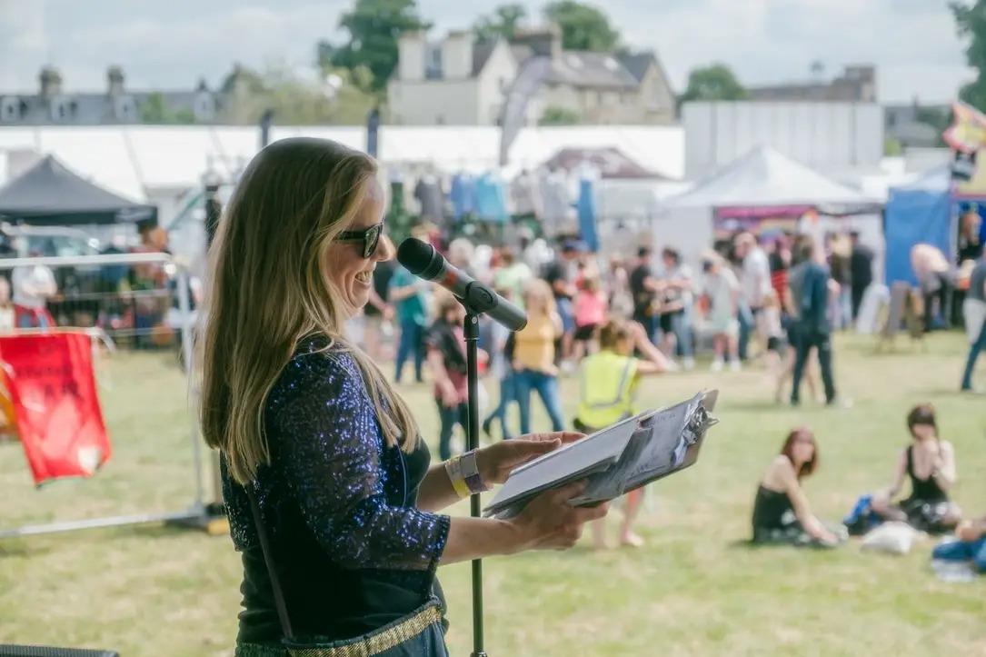 Amy Wragg performing poetry at Strawberry Fayre in 2023