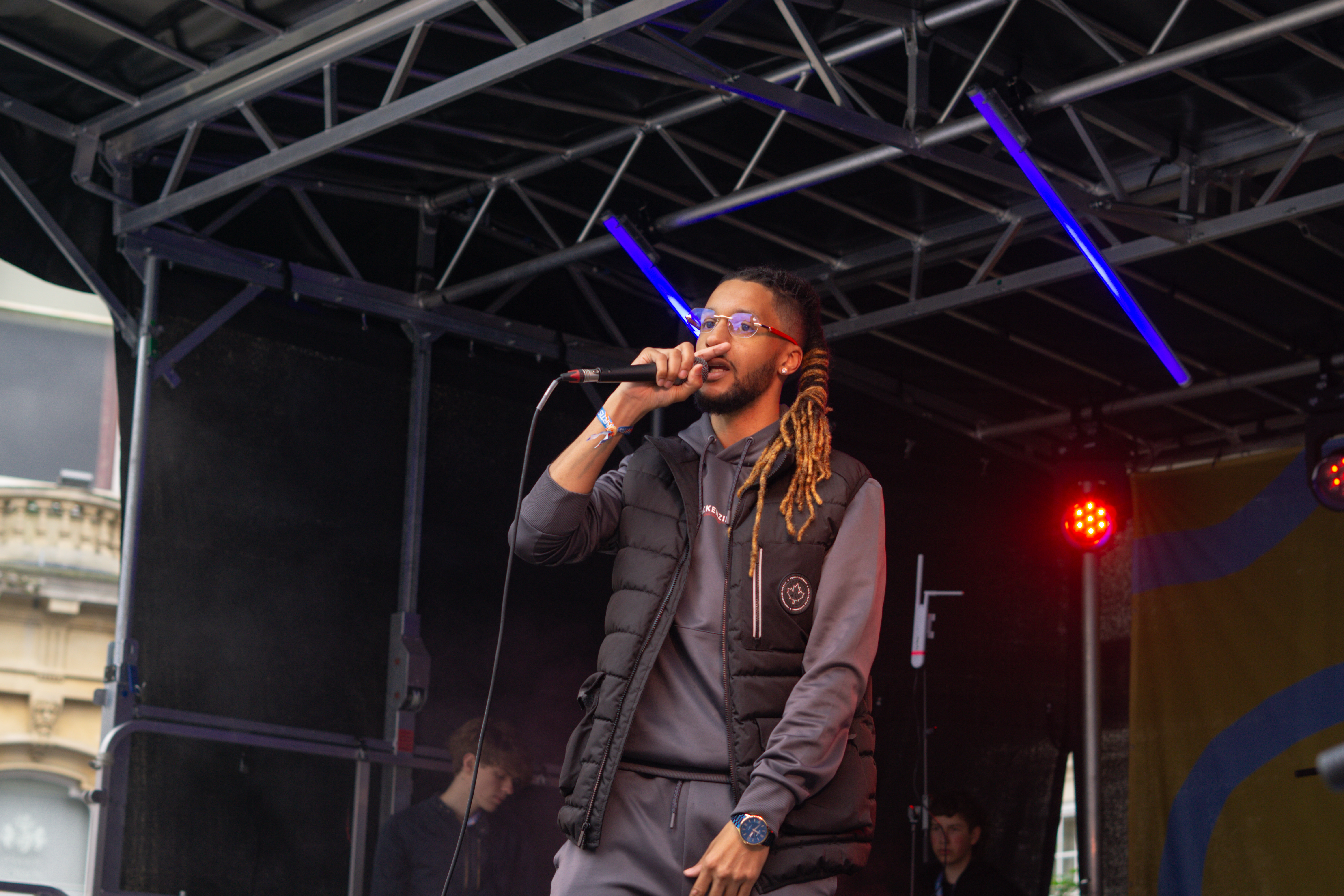 El-emcee performing at Brighten the corners